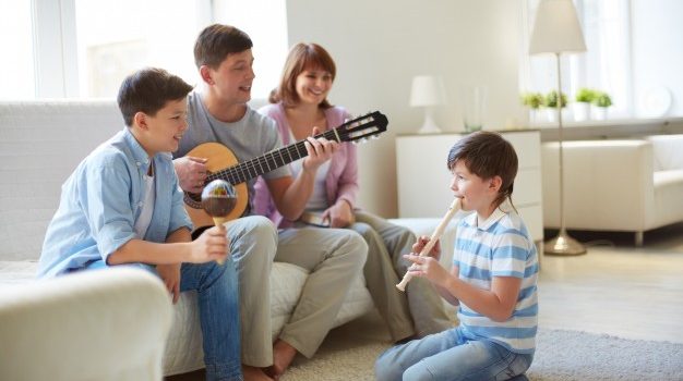 Family-playing-musical-instruments_1098-771